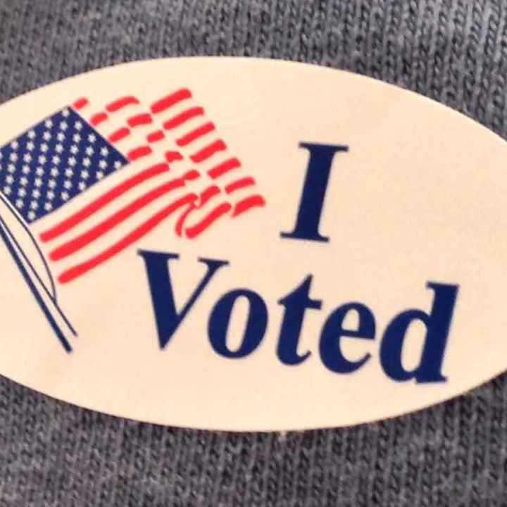 An "I voted" sticker with an American flag